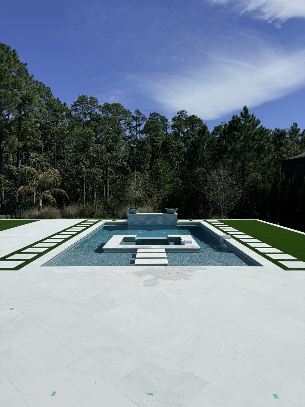 Luxury outdoor pool area with stone pavers