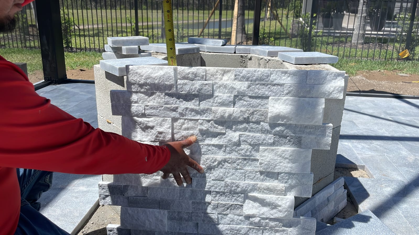 Mason carefully laying bricks